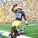 Michigan quarterback Devin Gardner carries the ball into the end zone for a touchdown against Iowa during the second quarter at Michigan Stadium. Melanie Maxwell I AnnArbor.com